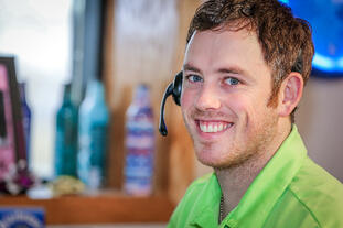 Bernick's employee smiling at the camera