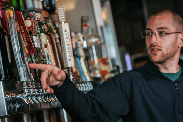 bartender pointing to tap selections