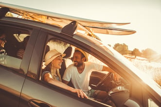 Picture of a family in a car on a road trip.