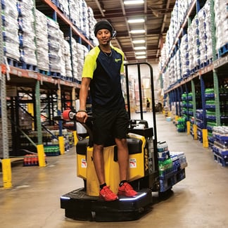 Bernick's employee working on a forklift in warehouse